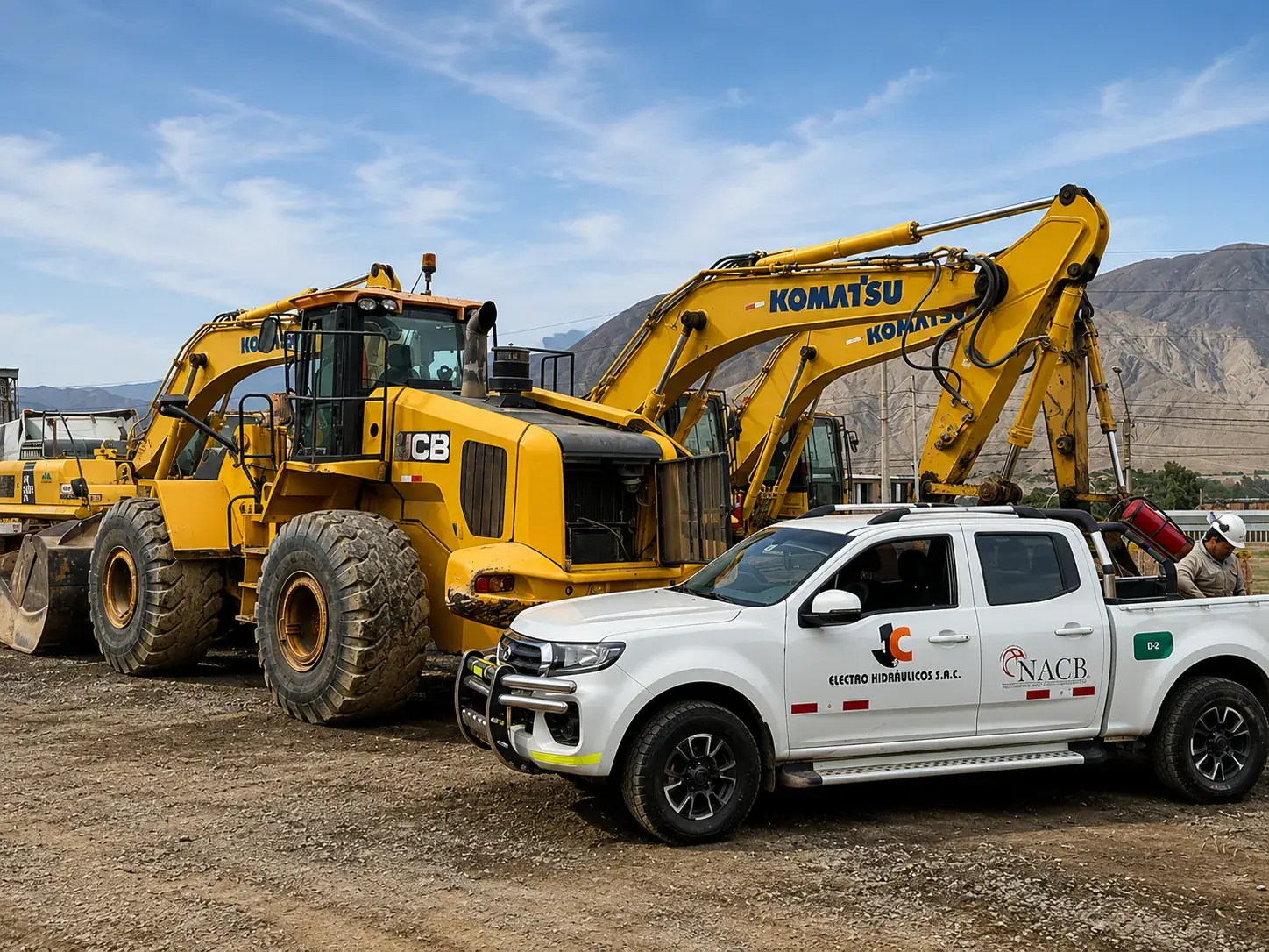 Cargador JCB, excavadora Komatsu y camioneta técnica de JC Electrohidráulicos en obra